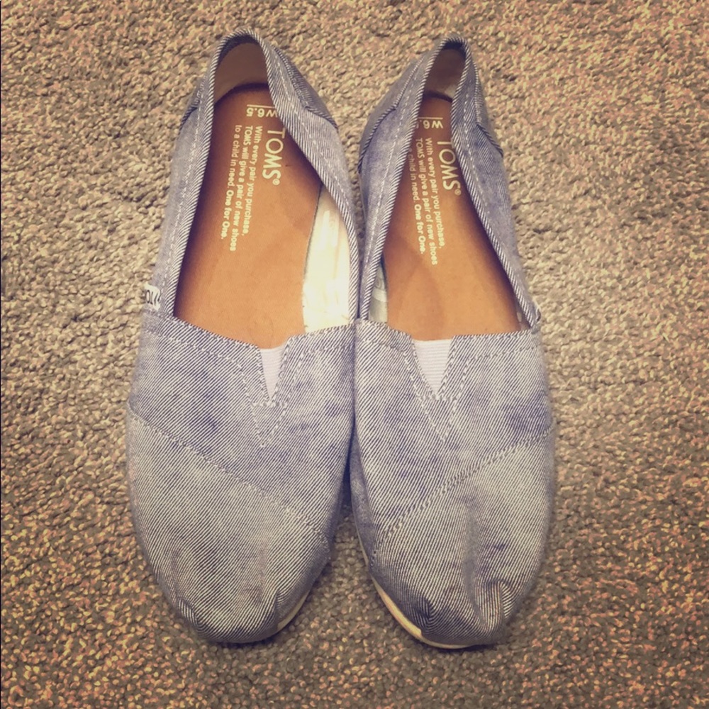 Toms slip ins in chambray blue with white.